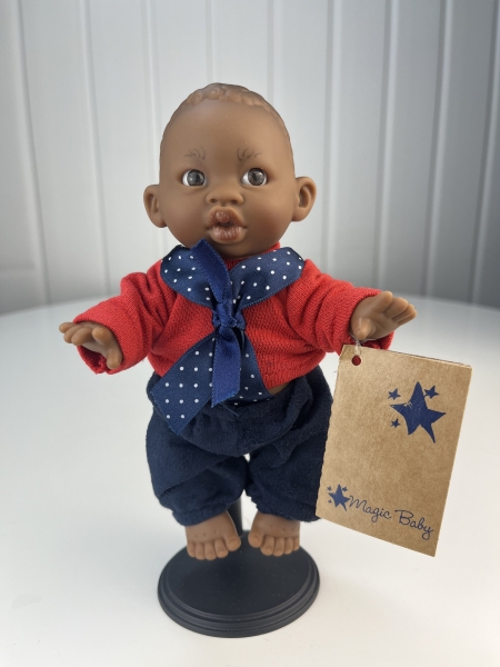 картинка испанские Кукла Джестито "Инфант", 18 см, в красной кофте с бантом, темнокожий, арт. 10000U-6 интернет-магазин TuKiTu.ru